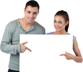 Young couple pointing at banner in front of them