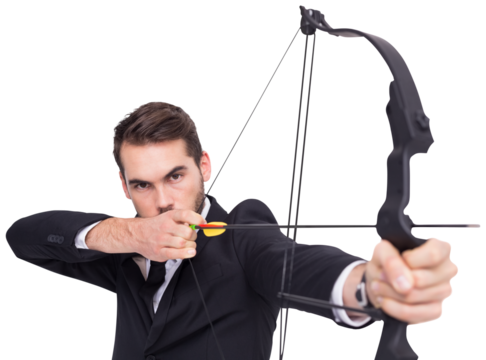 Smart businessman practicing archery looking at camera