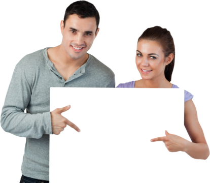 Young couple pointing at banner in front of them