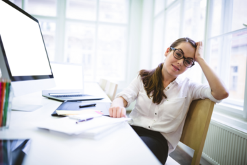 Portrait of tired woman sitting on chair