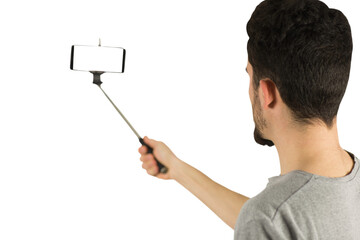 Casual man using a selfie stick