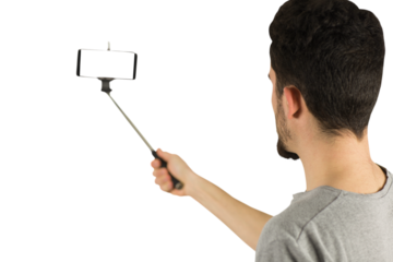 Casual man using a selfie stick