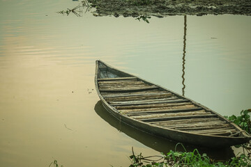 wooden boat moored in the river, Traditional boat in river of Bangladesh.