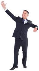 Smiling businessman waving on white background