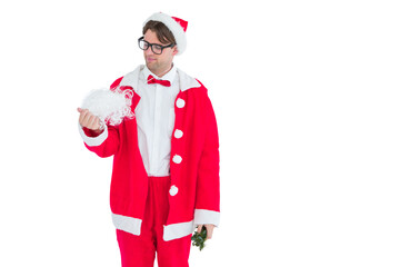 Geeky hipster in santa costume looking at beard 