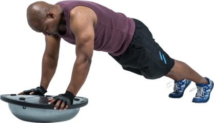 Fit man exercising with bosu ball