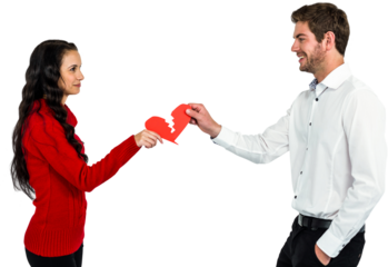 Couple holding red cracked heart shape