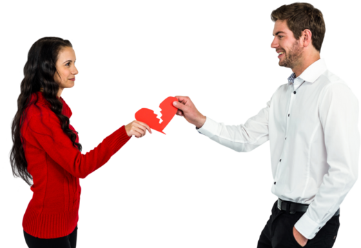 Couple holding red cracked heart shape
