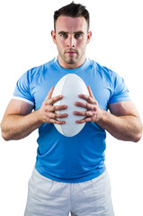 Rugby player looking at camera with ball