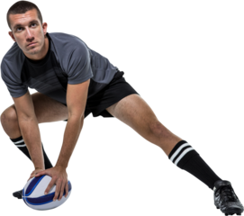 Sports player in black jersey stretching with ball