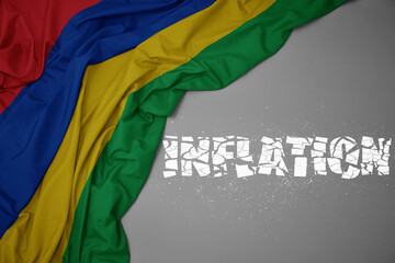 waving colorful national flag of mauritius on a gray background with broken text inflation. 3d illustration