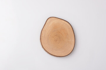 single natural wooden coaster isolated on white background. handmade. wooden display.