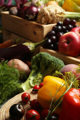 Different fresh vegetables and fruits on table, closeup. Farmer harvesting