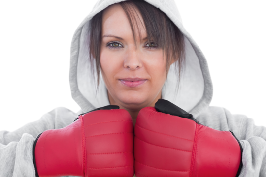 Closeup of young woman wearing boxing gloves - Powered by Adobe