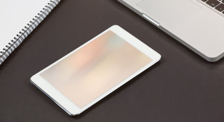 Composite image of digital screen, laptop and notebook