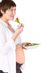 Smiling pregnant woman having salad