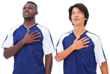 Football players respecting the anthem