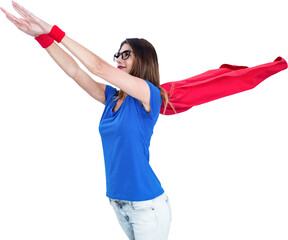 Woman in superhero costume pretending to fly 