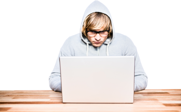 Man in hood jacket hacking a laptop