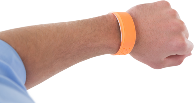 Cropped hand of businessman wearing orange smart watch