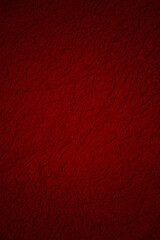 Abstract red grunge decorative stucco background. layout design. red leather texture, dark red leather material texture, useful as background for design work. red earth, red sand, red powder, powder