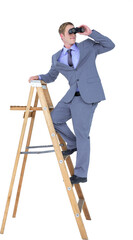 Businessman looking through binoculars while standing on ladder  © vectorfusionart
