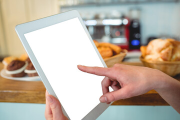 Cropped image of hand holding digital tablet