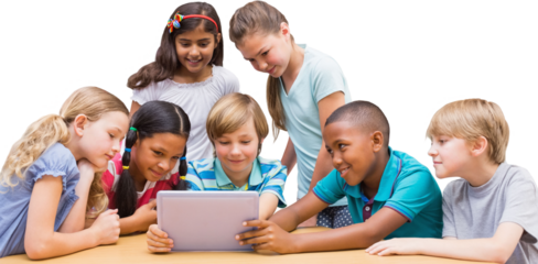 Cute pupils using tablet computer in library 