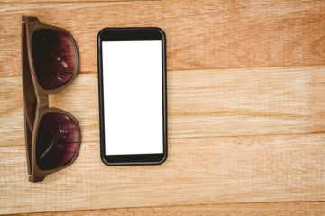 View of glasses and a smartphone