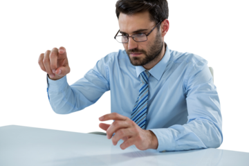 Businessman pretending to touch invisible object at desk
