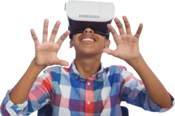 Happy boy looking through virtual reality simulator while sitting on chair