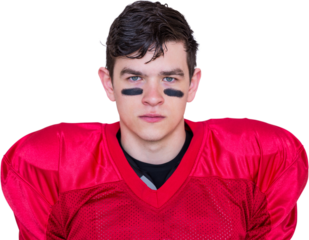 Serious american football player looking at camera 