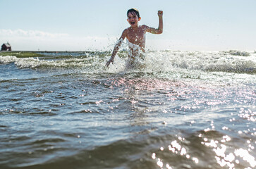 child playing on the beach