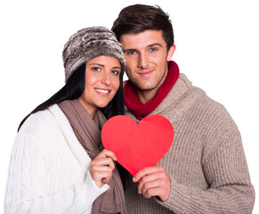 Young couple smiling holding red heart