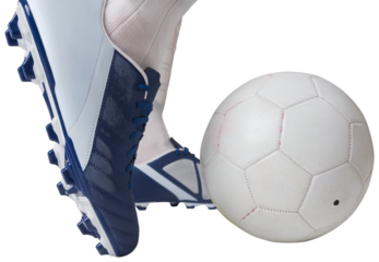 Close up of football player kicking ball