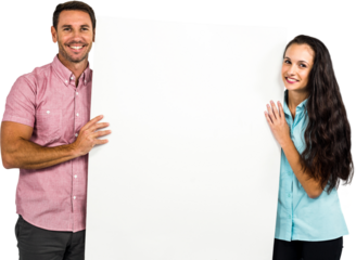 Confident smiling couple holding white sheet