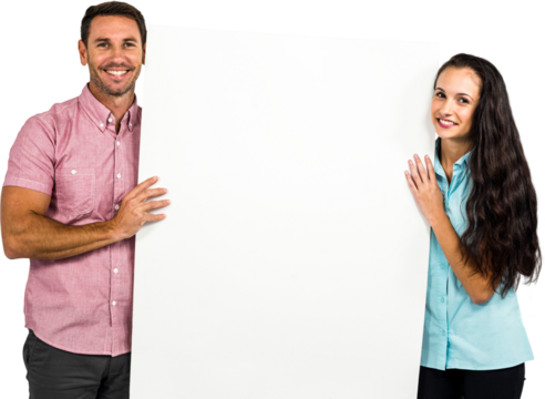 Confident smiling couple holding white sheet