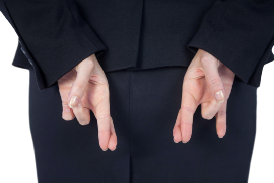 Rear view of businesswoman with fingers crossed behind her back