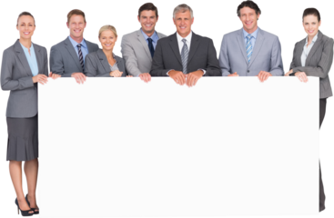 Smiling business team holding poster
