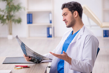 Young male doctor radiologist working in the clinic