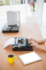 Human hands using typewriter