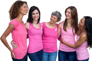 Smiling women in pink outfits talking while posing for breast cancer awareness