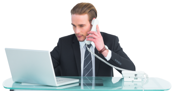 Serious businessman using laptop while phoning - Powered by Adobe