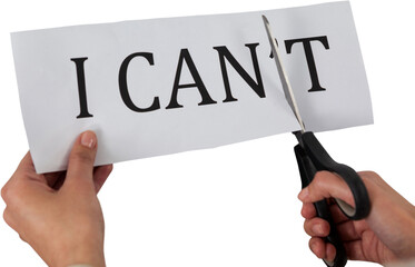 Conceptual image of businesswoman cutting paper that reads we cant