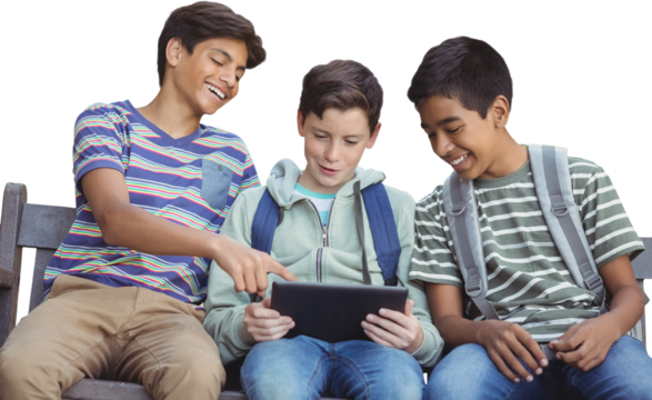 Boy with friends using digital tablet on bench