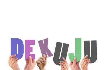 Hands holding colorful letters 