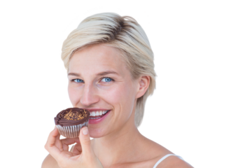 Attractive woman eating muffin