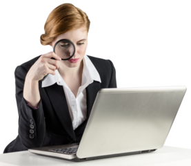 Redhead businesswoman using her laptop