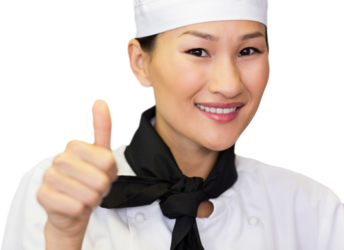 Portrait of smiling female cook gesturing thumbs up