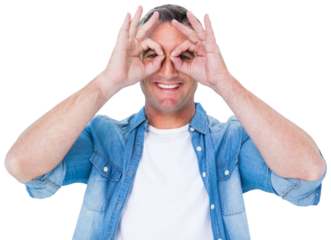 Smiling man with fingers around his eyes